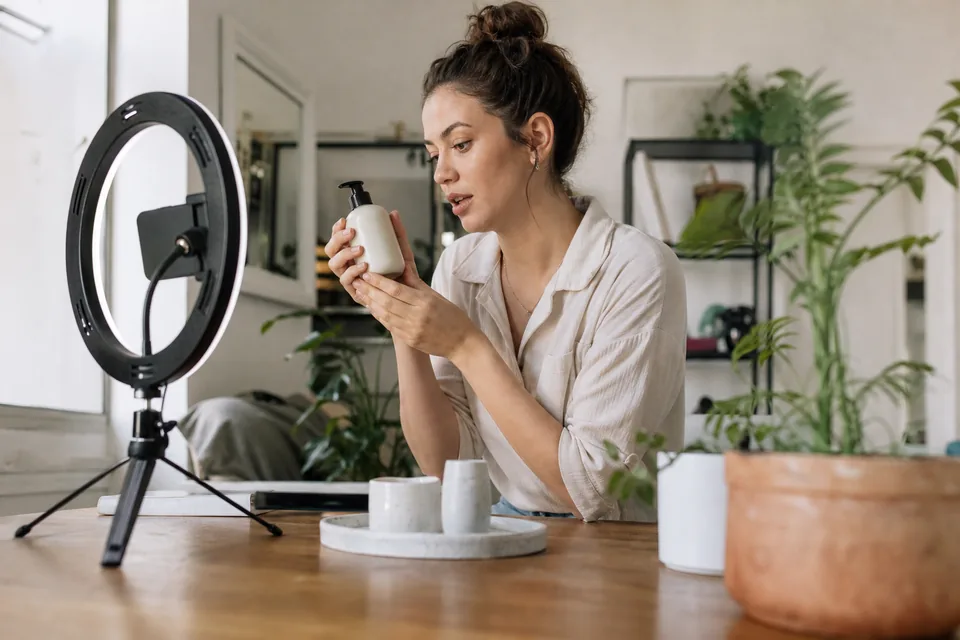 Creator filming a short product video on a smartphone for an ad